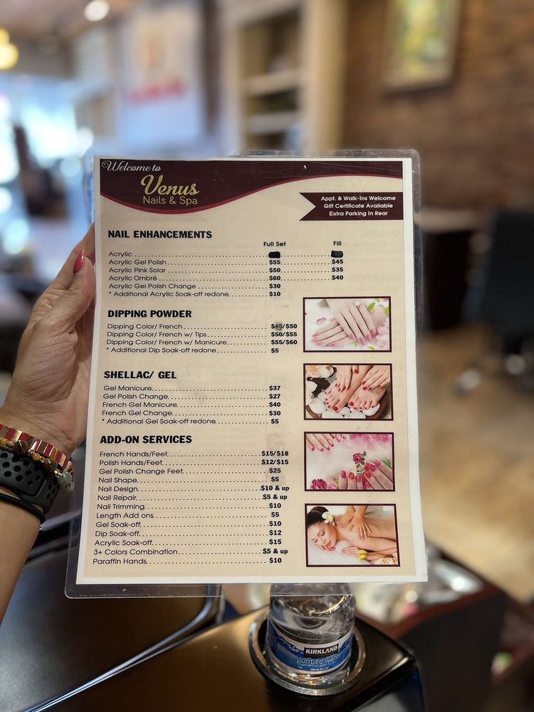 Printed Venus Nails and Spa menu showing enhancements, dip powder, gel, and add-on services