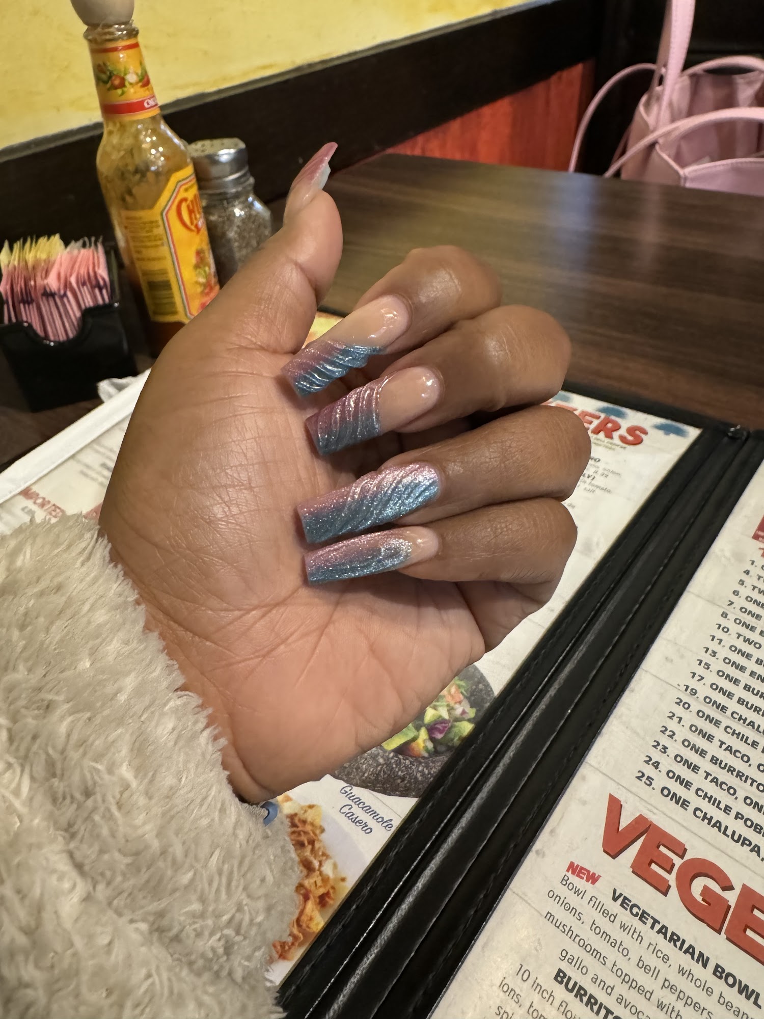 Blue and pink acrylic nail art from Venus Nails and Spa